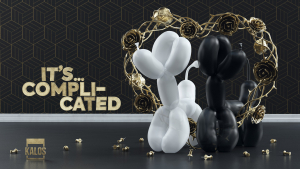 Two balloon dogs stand in rose arch